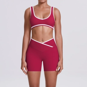 Detail of burgundy yoga set featuring white contrast trim and V-shaped crossover waistband