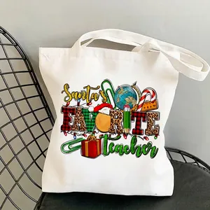 White canvas tote bag for teachers with colorful Santa's Favorite Teacher holiday print