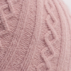 Pink cable knit winter baseball hat texture with soft mohair material details