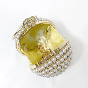 Luxurious spherical pearl evening clutch bag with gold hardware and chain strap