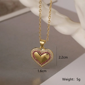 Detail view of heart pendant necklace with red and white zircons and dimensions 2.2cm x 1.6cm
