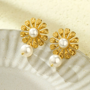Elegant gold flower pearl earrings in titanium steel with detailed leaf texture