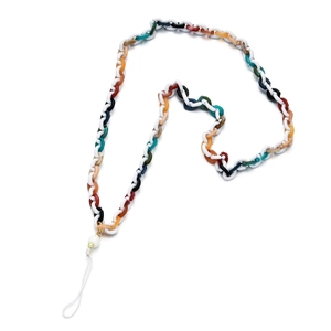 Detailed macro view of colorful resin acrylic link chain with pearl bead for phone