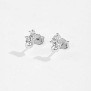 Close-up of S925 sterling silver flower stud earrings with small clear cubic zirconia