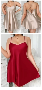 Detail of satin slip dress with thin straps and criss-cross back in champagne and red