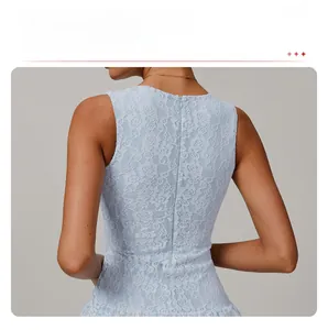 Detail of the light blue lace dress showing the invisible half-zipper on the back