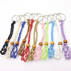 Handmade woven mesh keychain charms in eleven vibrant colors with natural wooden beads