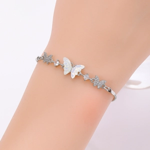 Detail of silver butterfly bracelet with mother of pearl and pavé cubic zirconia