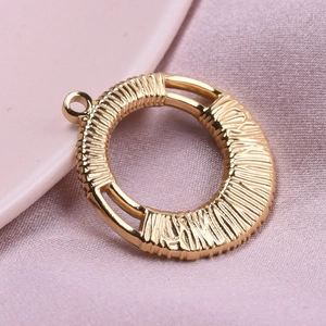 Round 304 stainless steel pendant with textured weave pattern and 18k gold plating