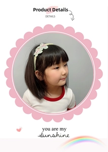 Close-up of yellow lace headband with embroidered butterfly and pearl for girls