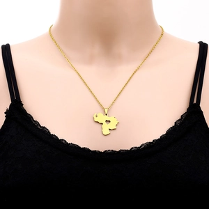 Golden Venezuela map pendant necklace with heart cut-out worn on a neck model