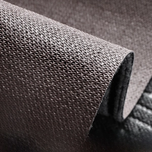 Close-up of durable entry mat showing anti-slip grid backing and fiber texture