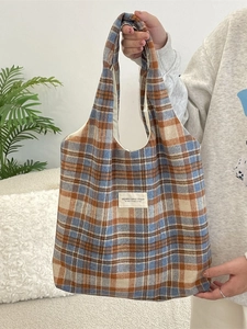 Retro orange plaid woolen tote bag for women shown in a cozy autumn winter setting