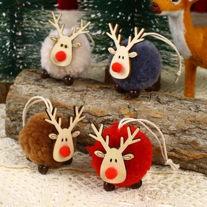 Detail of four reindeer plush ornaments with wooden heads on a festive lace background