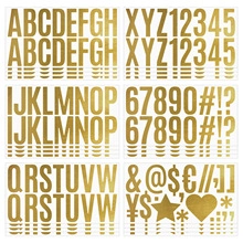 Detail of gold foil alphabet and number stickers for creative DIY scrapbooking