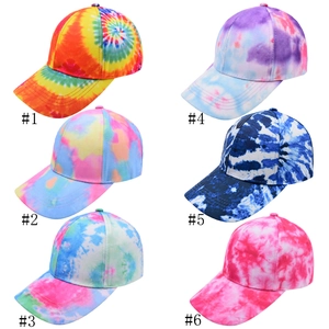 Six different tie-dye baseball caps in various colors with a classic curved brim design