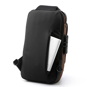 Waterproof chest bag detail showing anti-theft combination lock and front zipper pocket