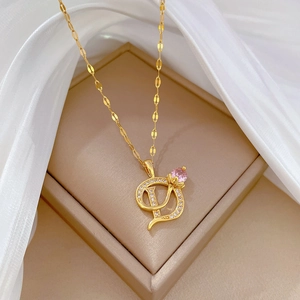 Elegant gold titanium necklace with D-letter pendant and pink crystal flower detail