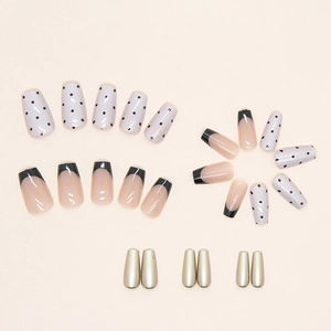 Short ballerina press-on nails with French pearl powder and black polka dot designs