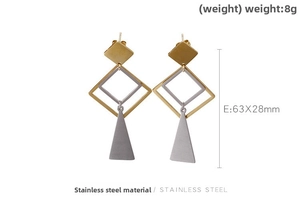 Macro shot of geometric stainless steel earrings with gold and silver square frames