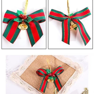 Red and green striped Christmas bow with gold bell and berries for tree decoration