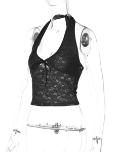 Detail of black lace halter top with criss-cross tie-front design and floral lace patterns