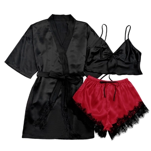 Three-piece satin sleepwear set with black robe, camisole, and red lace shorts