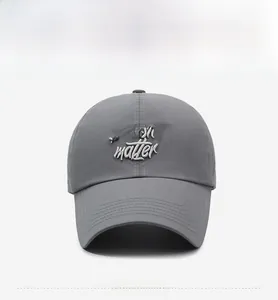 Close-up of 3D embroidery on dark gray quick-dry breathable baseball cap for sport