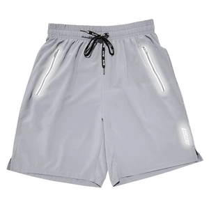 Detail of light grey quick-dry shorts featuring reflective zipper pockets and BUTZ drawstring