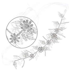 Detail view of silver bridal headband with crystal flowers and pearl embellishments