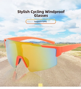 Detail of streamlined orange sports sunglasses with a large yellow polarized lens for cycling
