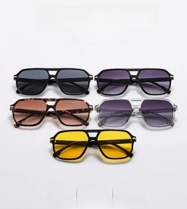 Detail view of double bridge pilot sunglasses in five diverse frame and lens colors