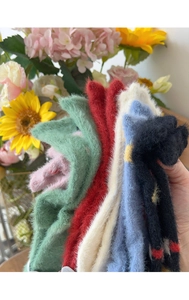 Close-up of thick winter faux mink socks in assorted colors with soft plush texture