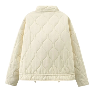 Women's cream white quilted jacket with wave patterns and high collar in a clean flat lay