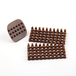 Macro view of brown plastic letter and number stamps set for fondant cake decorating