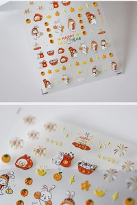 Detail of 5D nail art stickers with 2023 Chinese New Year rabbit and firework patterns