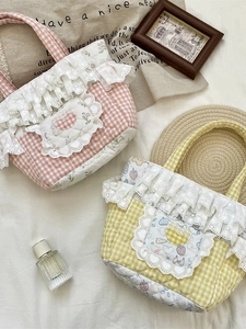 Quilted checkerboard tote bag with floral patterns and delicate white lace trim