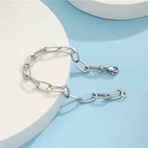 Minimalist silver stainless steel chunky chain bracelet with lobster clasp on white stand