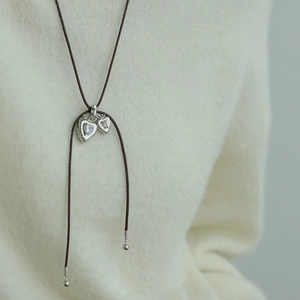 Minimalist double heart pendant necklace with hammered texture and sparkling stones