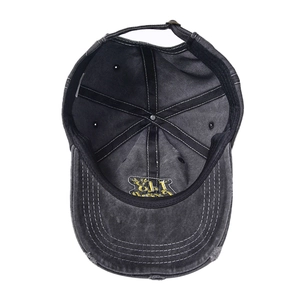 Top view of vintage washed cotton baseball cap showing internal stitching and yellow logo