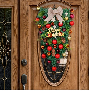 Christmas teardrop wreath with red and gold baubles and burlap bow on a wooden door