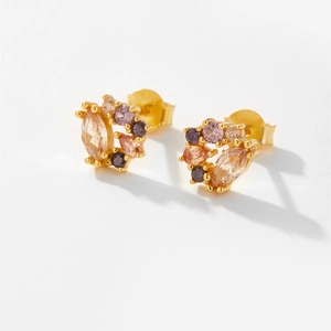 Macro shot of gold-plated S925 silver stud earrings with multicolor zircon cluster details