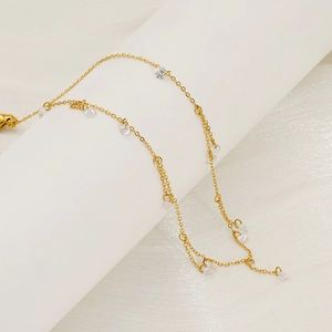 Elegant gold stainless steel choker necklace featuring round zircon tassel pendants