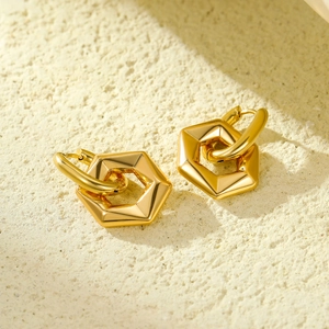 Minimalist gold hexagonal stainless steel stud earrings with polished metallic finish