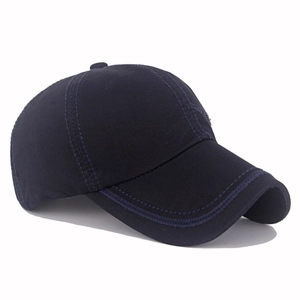 Close-up of a navy blue cotton baseball cap featuring high-quality stitching and curved brim