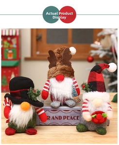 Detailed view of three assorted Christmas gnomes with plaid hats and reindeer antlers
