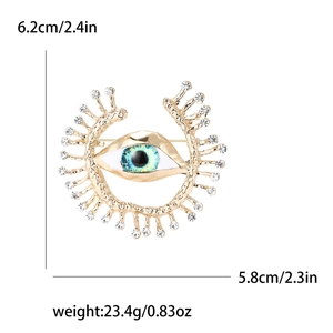 Gold evil eye brooch with crystals, size 6.2x5.8cm, weighing 23.4g on white background