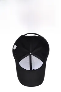 Detailed inner view of black polyester baseball cap with reinforced seams and care label