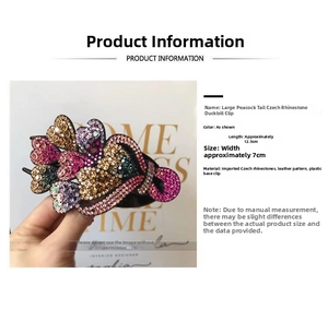 Detailed view of rhinestone peacock duckbill clip with dimensions 12.5cm by 7cm