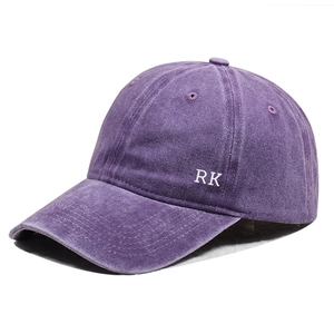 Vintage washed purple cotton baseball cap with RK side embroidery in a 45-degree angle view